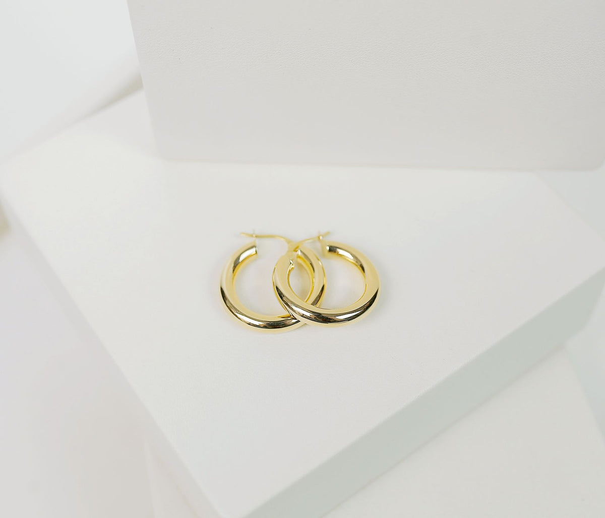 Gold hoop earrings, close-up
