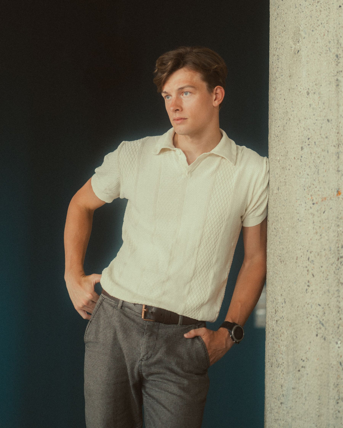 Model in a cream textured knit polo