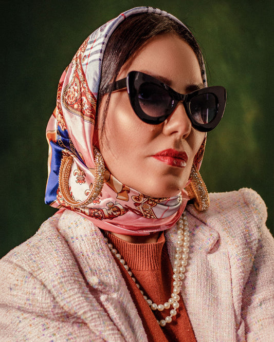 Printed silk scarf tied as a headscarf