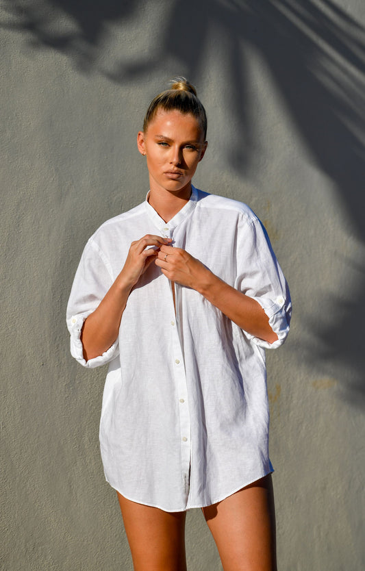 Model in a white relaxed linen shirt