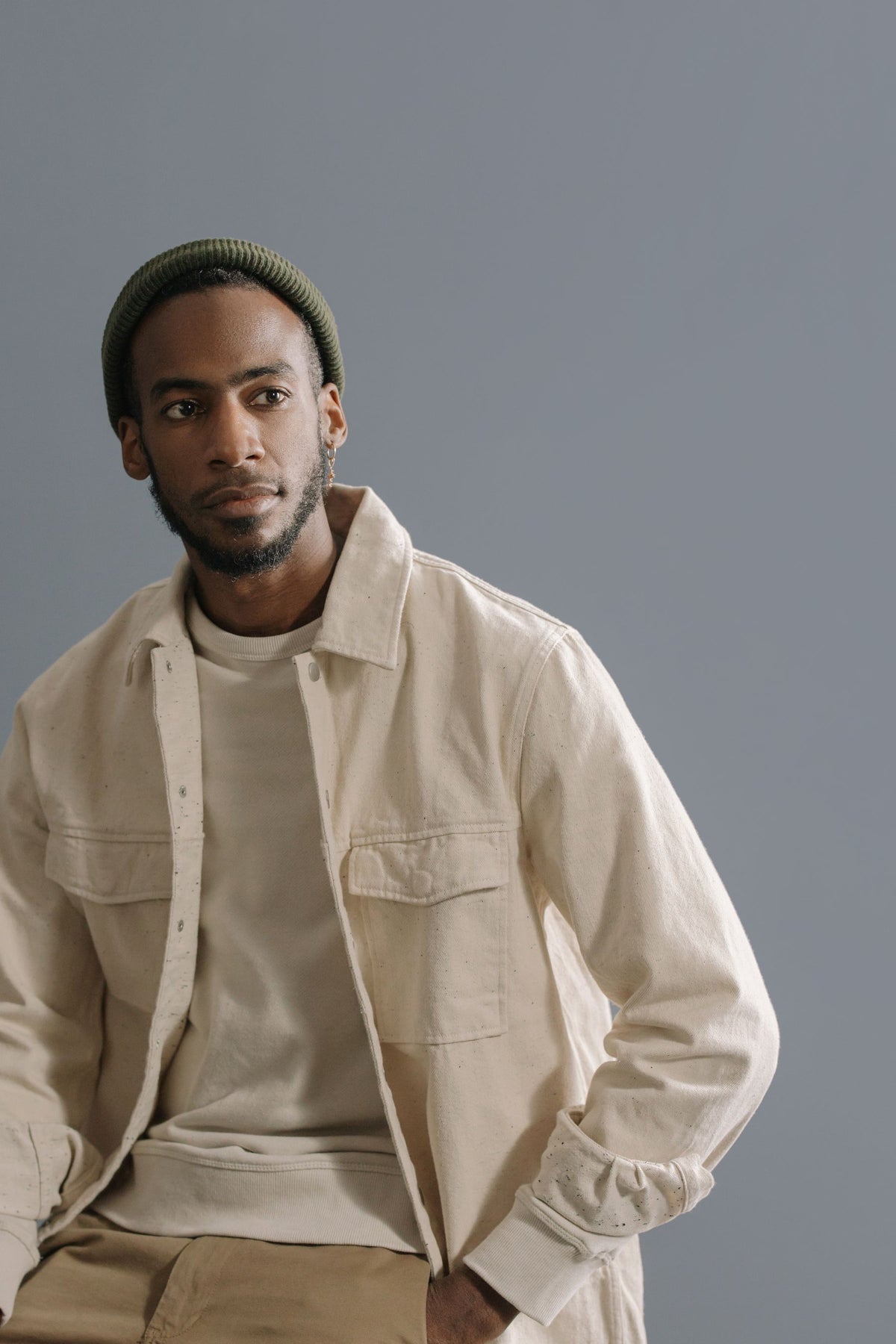Model in a cream cotton twill utility overshirt