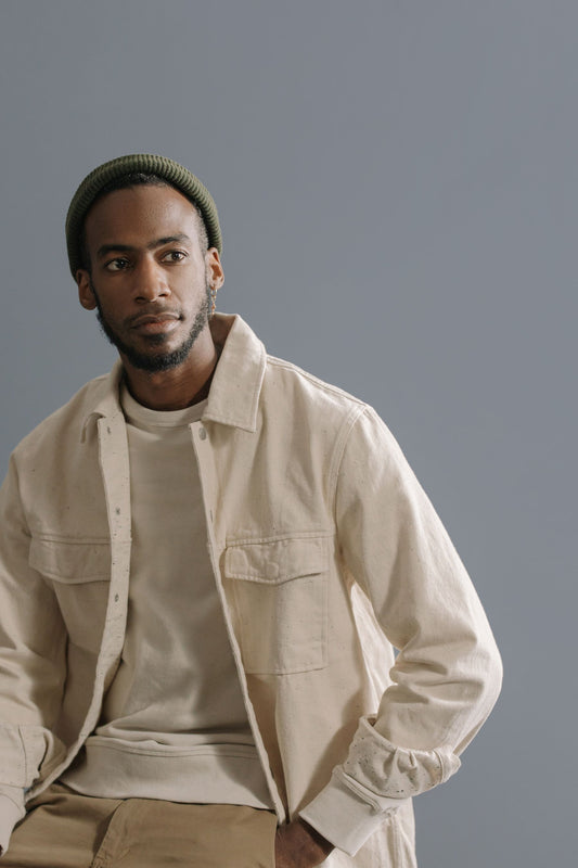 Model in a cream cotton twill utility overshirt