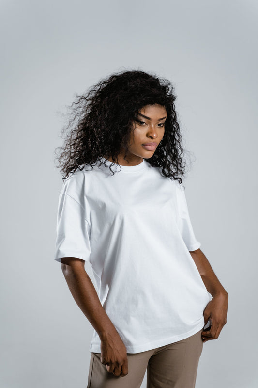 Model in a white relaxed organic cotton tee